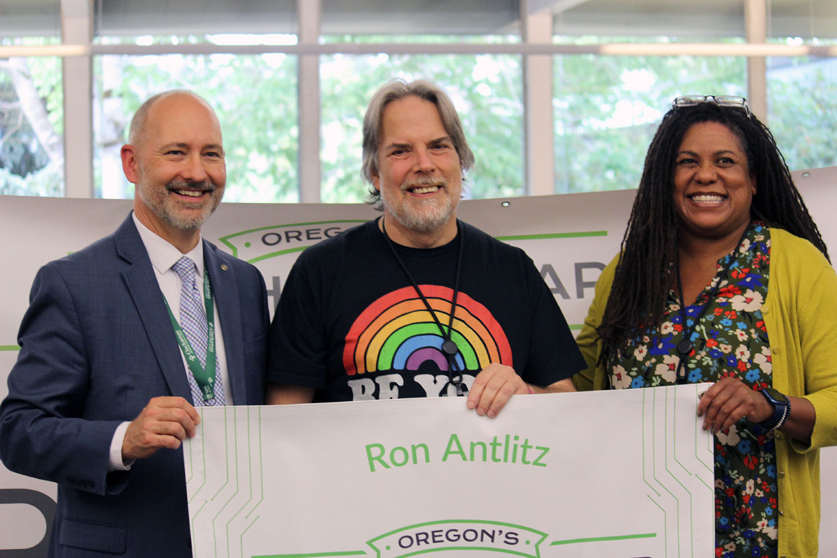 2023 Region Teacher of the Year Ron Antlitz with Clackamas ESD Superintendent Larry Didway and North Clackamas School District Superintendent Dr. Shay James holding an oversized check for Ron by the Oregon Lottery