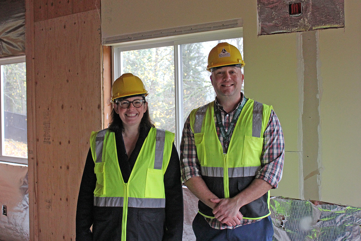 ara Snow, director of early intervention and early childhood special education, and Brett Walker, assistant director early learning programs check progress on one of the new classrooms of the new early learning center