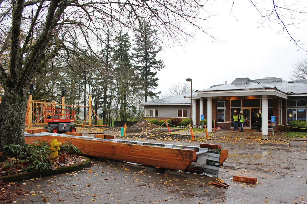 View of the front of the new early learning center site with construction materials and equipment in view